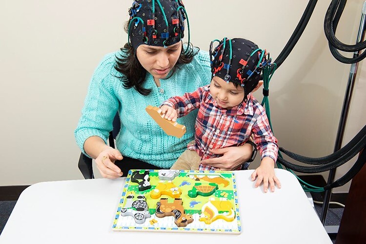 Mother-child neural synchronization is time linked to mother-child positive affective state matching.