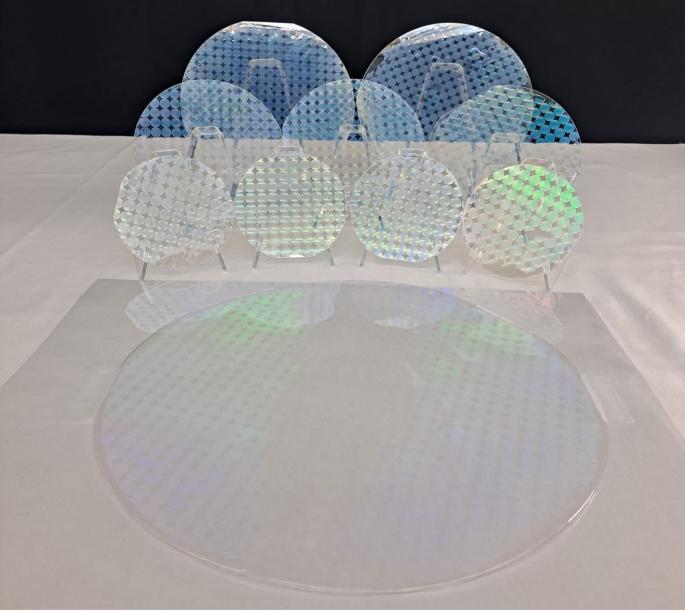 Scalable manufacturing of high-index atomic layer–polymer hybrid metasurfaces for metaphotonics in the visible