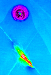 Photoluminescence mapping of laser-damaged β-Ga2O3