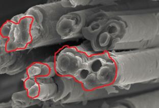 Kinetics of Pyrocarbon Formation on the Surface of Carbon Fiber Filament