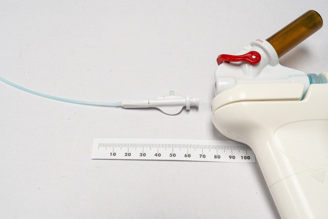 Modification of a hemostatic powder spray device for delivery through an incompatible endoscope.