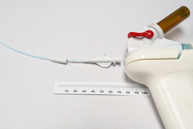 Modification of a hemostatic powder spray device for delivery through an incompatible endoscope.