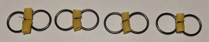 Using half-hitch knots to uncouple surgical knot security and loop tautness.