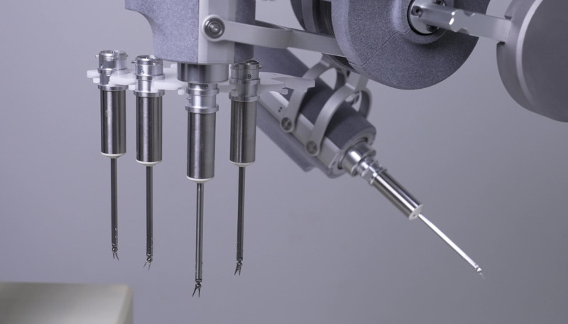The First Microsurgery-assisting Robot Equipped With an Automatic Instrument Exchange System and a Miniature Tool Kit.